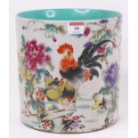 A Chinese porcelain brush-pot, enamel decorated with a rooster and hen, h.22cm