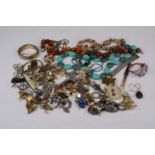 A collection of costume jewellery to include Milanese-style chain link bracelet, hinged gilt metal