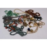 A collection of costume jewellery to include crucifix pendant, hard stone bead necklaces and Art