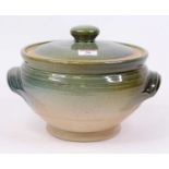 A green glazed studio pottery jar and cover, signed Ray Auker 2000, w.28cm