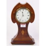 An Edwardian mahogany and boxwood strung mantel clock, the enamel dial showing Roman numerals, h.