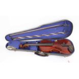 A student's violin and bow, cased