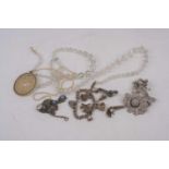 A silver charm bracelet with eight suspended charms, together with various jewellery, to include