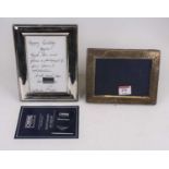 An Edwardian silver clad easel photograph frame with hammer beaten decoration, height 12cm, together