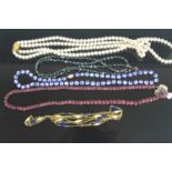 Assorted costume jewellery to include beaded and faceted garnet necklace, faux pearl necklaces,