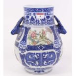A Chinese blue and white porcelain vase, of baluster form, flanked by deer head handles, h.28cm