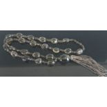 A beaded and faceted smoky glass long necklace, 96cm