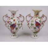 A pair of Chelsea style porcelain vases, each decorated with birds amongst foliage, blue anchor