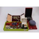 A collection of mainly oriental costume jewellery to include hard stone pendants, and simulated