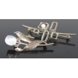 A white metal moonstone set leaf and flower brooch; together with a contemporary white metal
