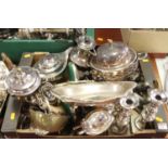 A box of silver plated items to include a coffee pot, wine funnel, candlesticks etc