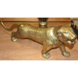 A large brass model of a tiger, length 76cm; together with a brass jardiniere; further brassware;