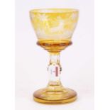 A 19th century Bohemian amber overlaid glass goblet, decorated with stags, h.25cm A couple of