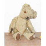 A vintage blond mohair teddy bear, having glass eyes and jointed limbs, approx 38cm
