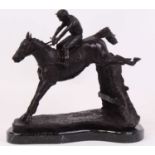 A bronze model of a horse and jockey, upon a polished black hardstone plinth, h.33cm