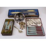 A Victorian carving set having a silver plated mount and simulated ivory handles (cased), together