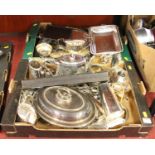 Two boxes of silver plated items to include teapots, flatware, and trays