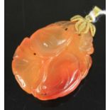 A Chinese carved carnelian pendant, on yellow metal pendant mount stamped 14k, 13.1g, 4cm (excluding