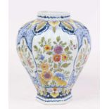 A 20th century Delft vase, of inverse baluster form, polychrome decorated with flowers, h.23cm