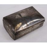 An early 20th century silver table cigarette box, of rectangular form, having hinged lid and cedar