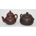 Two Yixing type red ware teapots, the largest h.8cm