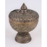 An Indian white metal pedestal dish and cover, with repousse floral decoration throughout, h.16cm,