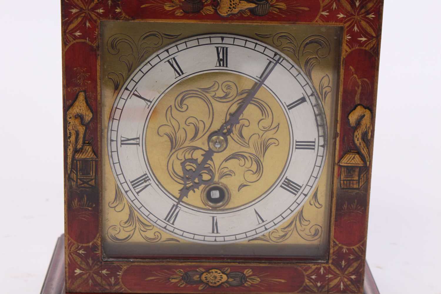 An 18th century style red lacquered cased bracket clock, the silvered chapter ring showing Roman - Image 2 of 3