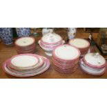 A Victorian dinner service, having a pink and gilt border