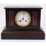 A Victorian slate and rouge marble mantel clock, the enamel dial showing Roman numerals, having an