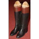 A pair of vintage leather riding boots and trees, probably size 9