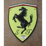 A reproduction cast iron Ferrari badge, 30 x 20cm