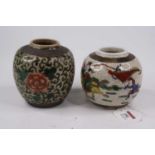 A Chinese ginger jar, enamel decorated with soldiers, height 10cm, together with another similar (2)