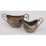 A Victorian silver twin handled sugar bowl of half gadrooned oval shape, William Thorneywork,