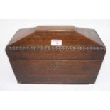 A 19th century walnut tea caddy, of sarcophagus form, w.31cm