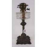 A Victorian brass oil lamp, having a faceted clear glass font, h.43cm