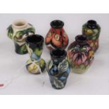 A set of six Moorcroft miniature vases, each approx 5.5cm high within presentation box Early