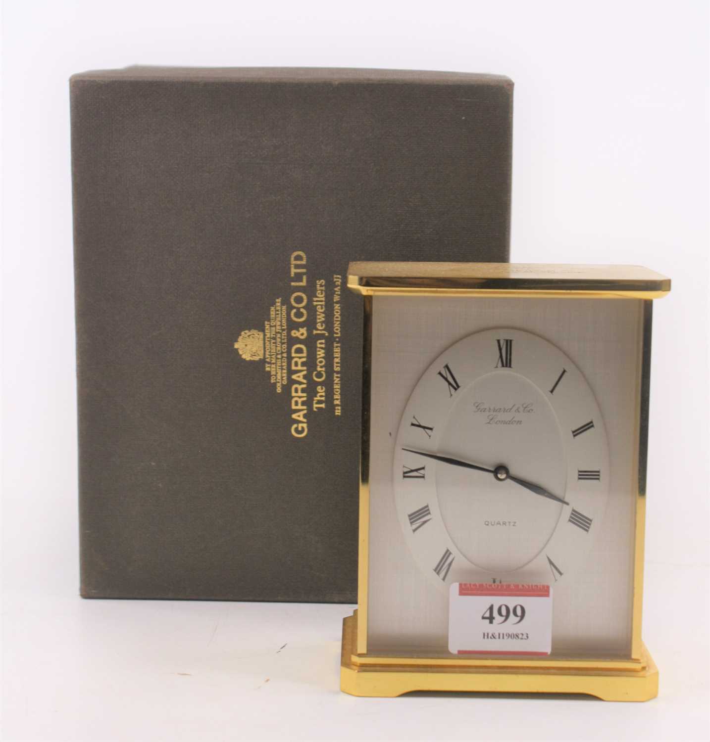 A Garrard & Co. quartz brass cased mantel clock, height 13cm, boxed