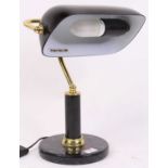 A brass adjustable desk lamp, having a black glass shade, h.38cm Not pat tested – sold as a