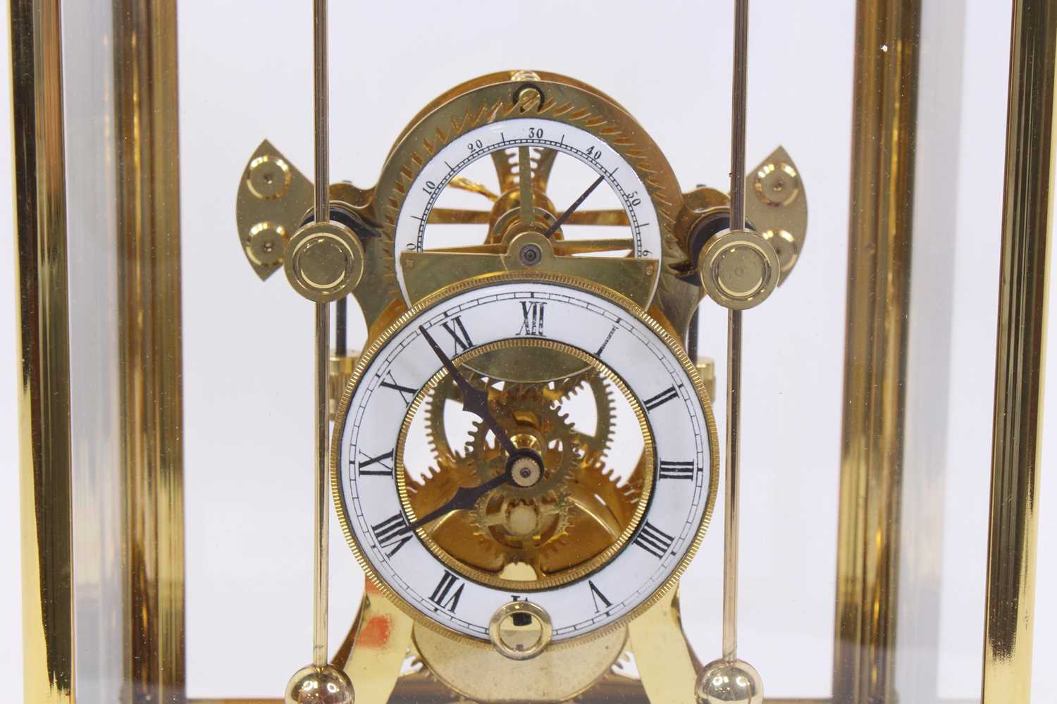 A 20th century brass skeleton clock, the enamelled chapter ring showing Roman numerals, having - Image 2 of 3