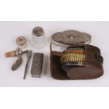 An Edwardian silver-clad gent's clothes brush set, in a brown leather case, Birmingham 1909;