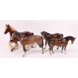 A Beswick model of a horse, chestnut gloss, h.20cm; together with two other similar; and a Melba