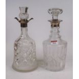 A George VI cut glass decanter, of bell shape, having a spouted silver collar, h.28cm; together with