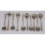 A set of six continental silver teaspoons, each having a tapered cylindrical handle, together with