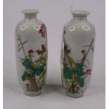 A pair of Chinese porcelain vases, each enamel decorated with birds amongst flowers, height 14cm