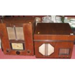 An Art Deco walnut cased radio/gramophone, w.48cm; together with a similar radio; and two portable