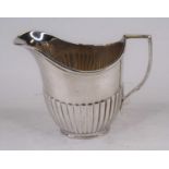 A George V silver cream jug, of half-reeded oval shape, William Hutton & Sons Ltd, Sheffield 1921,
