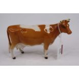 A Beswick model of a cow, height 11cm