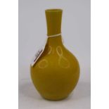 A Chinese yellow glazed bottle vase, height 16.5cm Modern – condition is good.