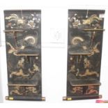 A pair of Japanese black lacquered wall shelves, gilt decorated with dragons, height 58x26cm