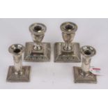 A pair of Victorian weighted silver dwarf table candlesticks, in the neo-classical style, London